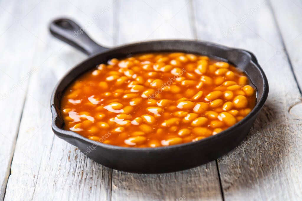 Baked beans, classic american staple food served in a skillet