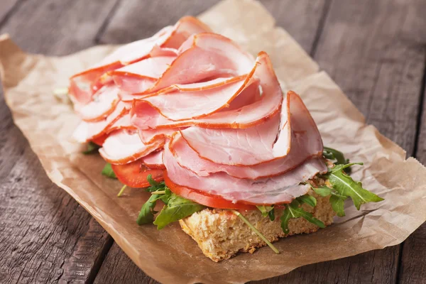 Submarine sandwich with smoked ham — Stock Photo, Image