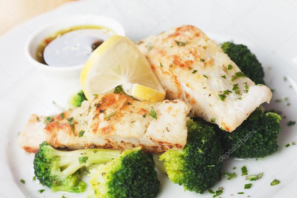 Grilled cod fish steak with broccoli