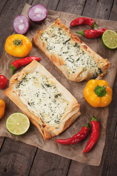 Phyllo pastry filled with cheese and spinach — Stock Photo, Image