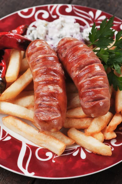 Grilled sausages with french fries — Stok fotoğraf