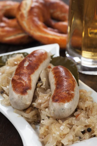 German white sausage with sauerkraut and preztel — Stock Photo, Image