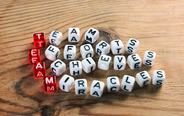 Team acronym on dices — Stock Photo, Image