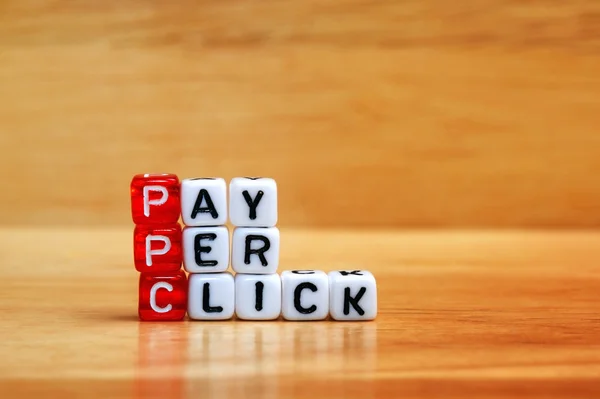 PPC Pay Per Click dices on wooden table — Φωτογραφία Αρχείου