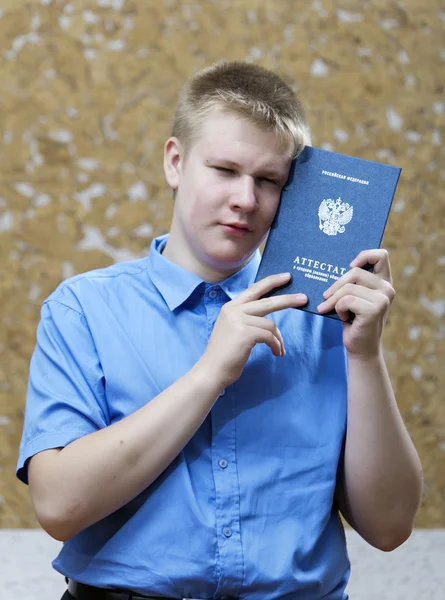 Schoolboy with the certificate about completion of education at school — Stock Photo, Image