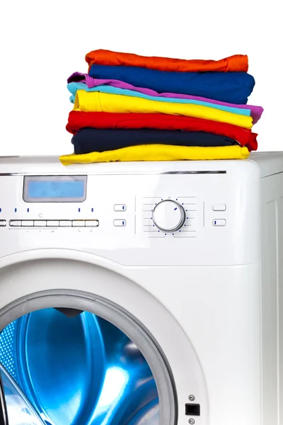 Pile of colorful clothes on the washing machin — Stock Photo, Image