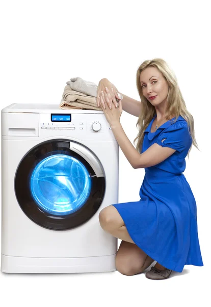 The happy young woman near the new washing machine — Stock Photo, Image