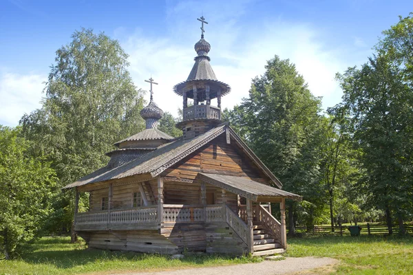 Ancient wooden church on a forest glade. Russia — Stock Photo, Image