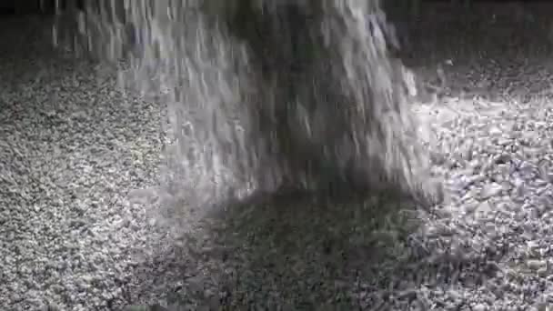 The granular cement crumb pours , slow motion — Stock Video