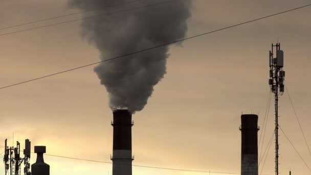 Industrial landscape. power line and smoke from pipes of combined heat — Stock Video