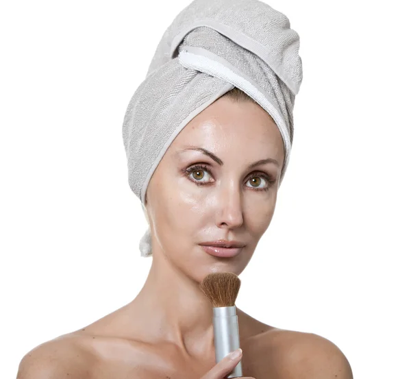 Beautiful young woman in towel with a brush for a make-up — Stock Photo, Image