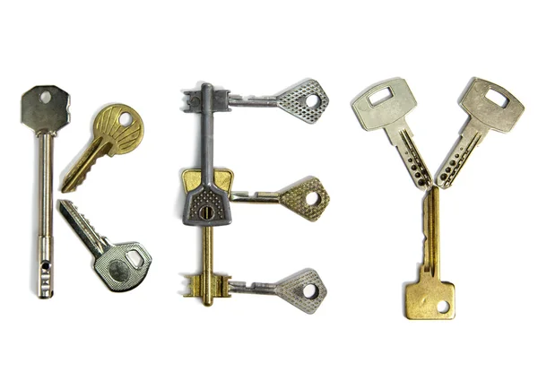 Kelime "anahtar" anahtar taşı-in çeşitli form, beyaz bir arka plan üzerinde yapılır — Stok fotoğraf