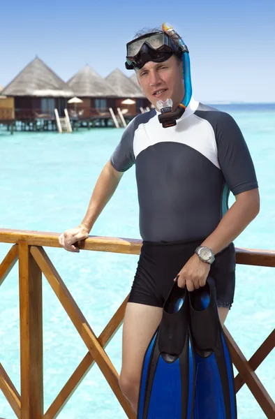 The sports man in a suit for a snorkeling on sundeck of a house over the sea. Maldives — Stock Photo, Image