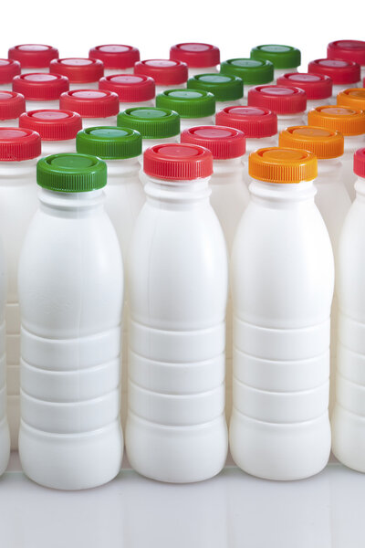 Dairy products bottles with bright covers