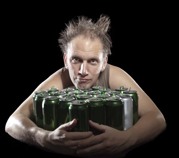 Hangover.The drunk man and is a lot of empty beer cans — Stock Photo, Image