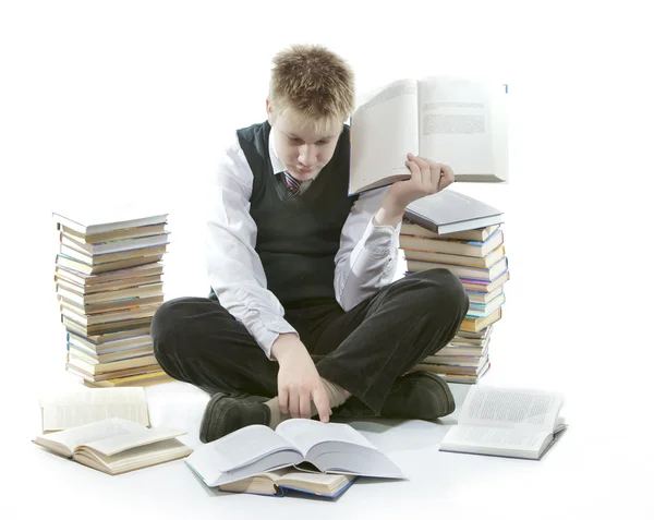Teenager s haldy učebnic. byl unavený z domácích úkolů. — Stock fotografie