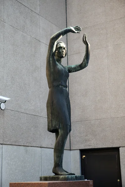 HELSINKI, FINLAND - MARCH 17, 2013: The bronze sculpture "Dawn" (the girl protects eyes from the sun) at a wall of National Bank of Finland, 1956 on march 17, 2013 in Helsinki, Finland. — Stock Photo, Image