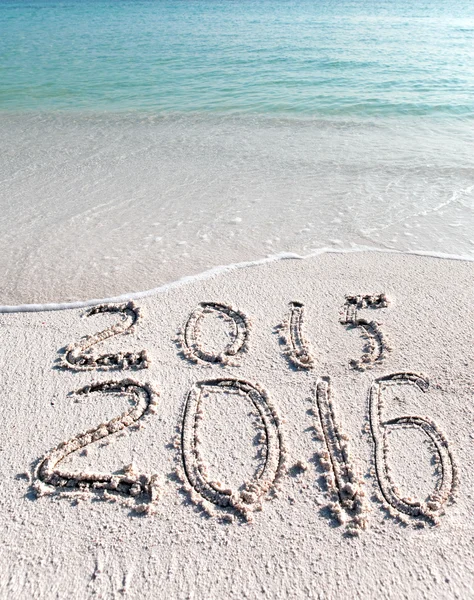 New 2016. The wave washes off an inscription 2015 — Stock Photo, Image