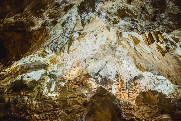 Underground cave, amazing scene , view of stalactites and stalagmite under ground , formation inside.