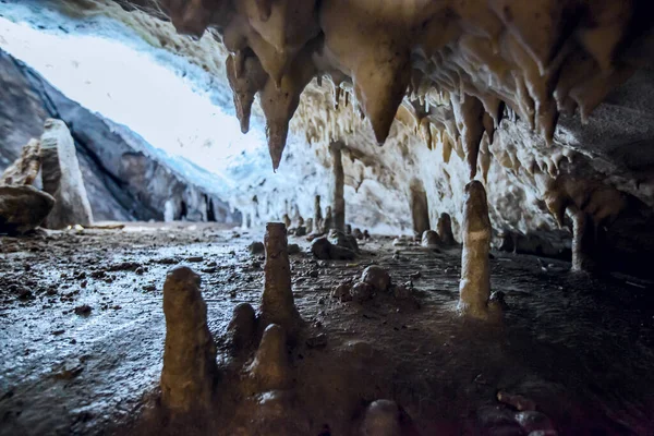 Underground cave, amazing scene , view of stalactites and stalagmite under ground , formation inside.