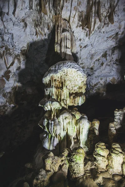 Underground cave, amazing scene , view of stalactites and stalagmite under ground , formation inside.