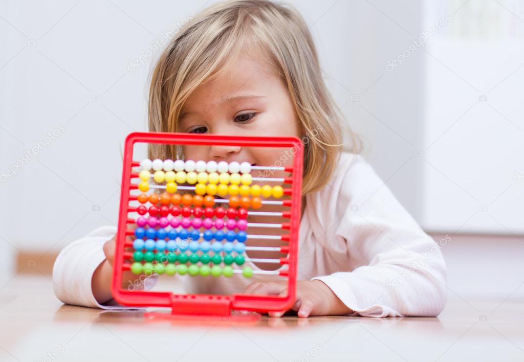 Little girl learning with abacus