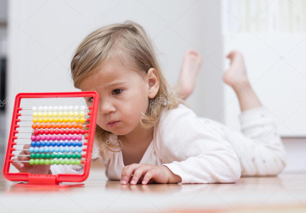 Little girl learning with abacus