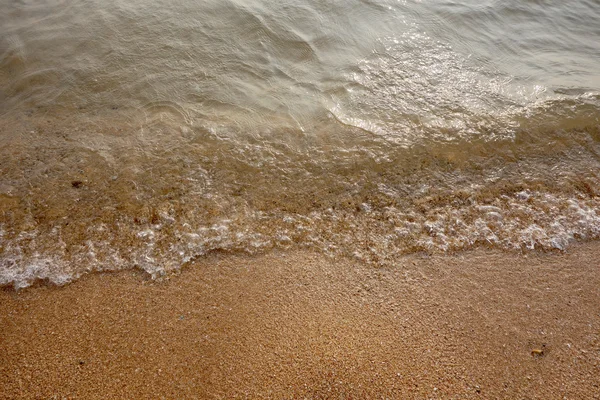 Písek a malé vlna — Stock fotografie