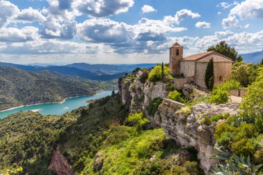 View of the Romanesque church of Santa Maria de Siurana in Catal clipart