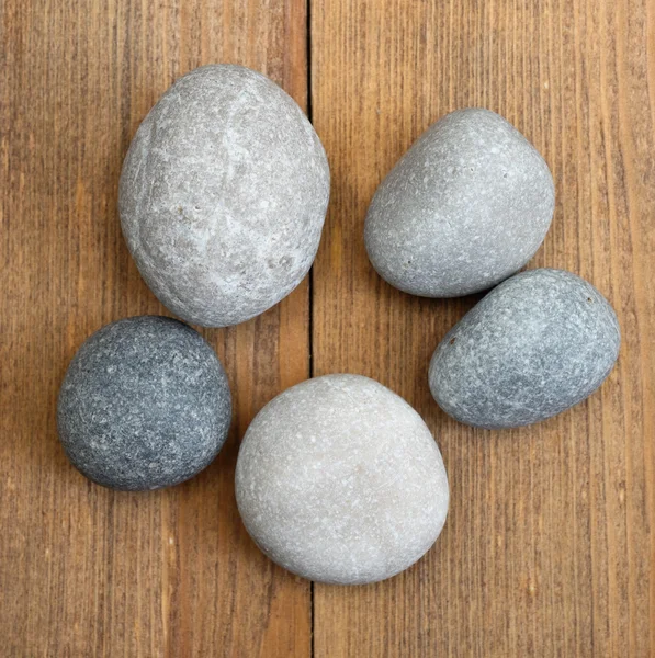 Stones on wooden background — Stock Photo, Image