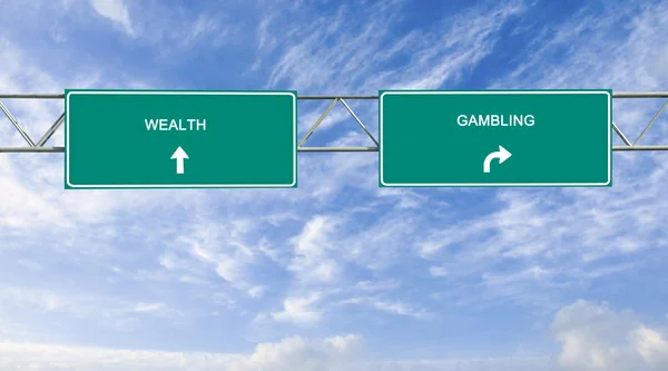 Road sign to wealth and gambling — Stock Photo, Image