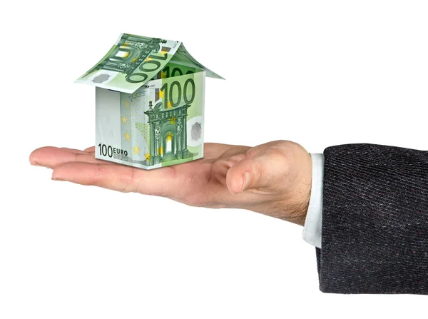 Dinheiro casa e mão isolada no fundo branco — Fotografia de Stock