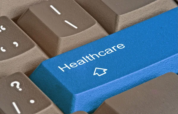 Keyboard with key for healthcare — Stock Photo, Image