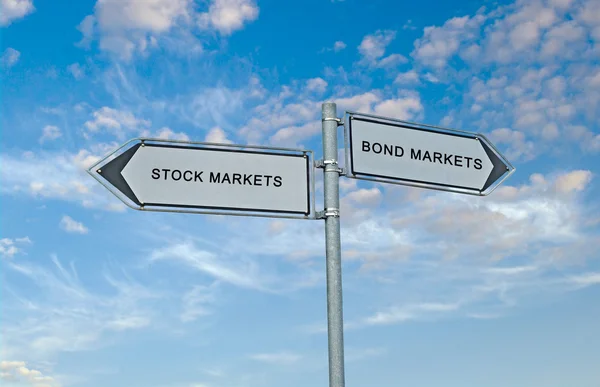 Road signs to bond market and stock market — Stock Photo, Image