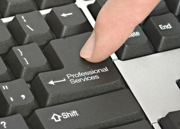 Teclado com chave para serviços profissionais — Fotografia de Stock