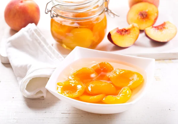 canned peaches in a bowl