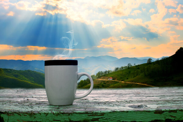 cup of cofe and mountains 