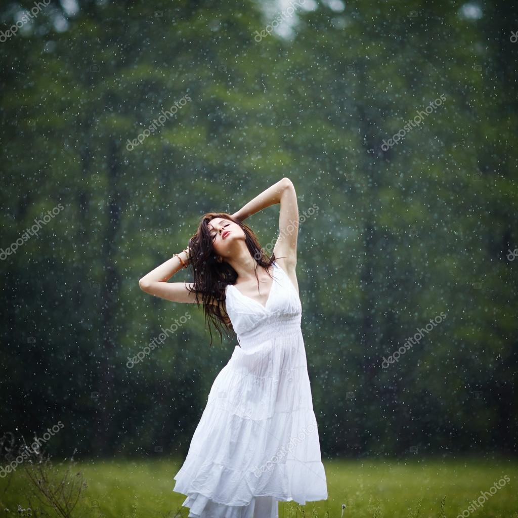 Beautiful girl under rain Stock Photo by ©ababaka 104559074