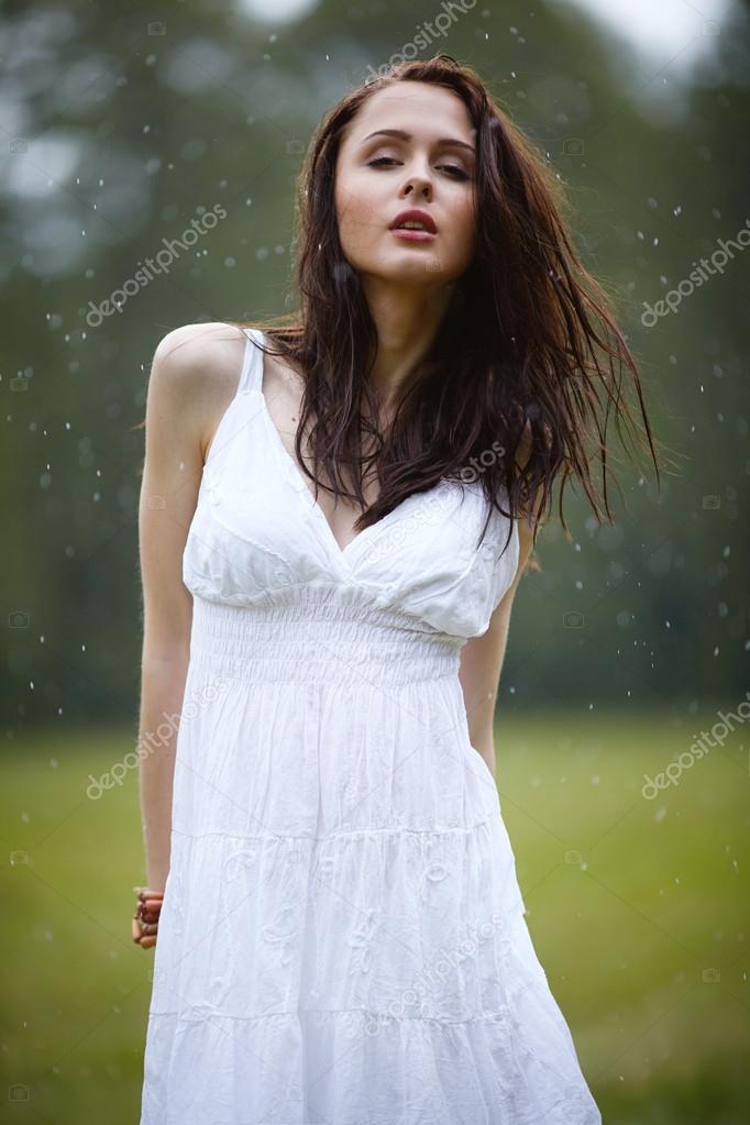 Beautiful girl under rain Stock Photo by ©ababaka 104560072