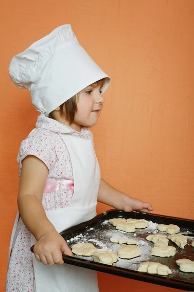 Little cute chef cooking biscuits — Stock Photo, Image