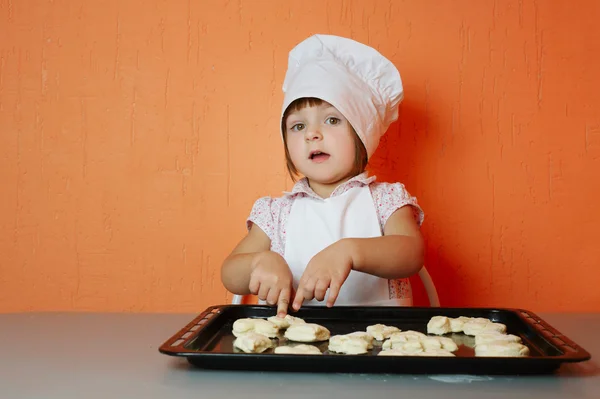Little cute chef cooking biscuits — Stock Photo, Image