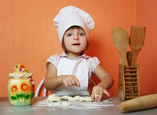 Little cute chef cooking biscuits — Stock Photo, Image