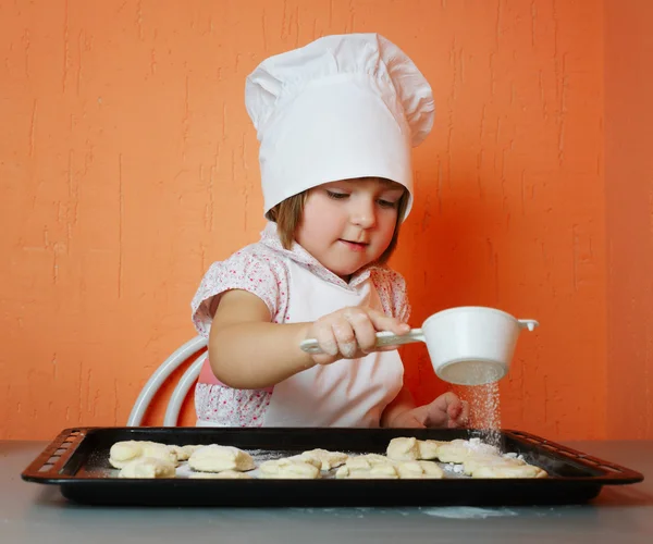 Little cute chef cooking biscuits — Stock Photo, Image