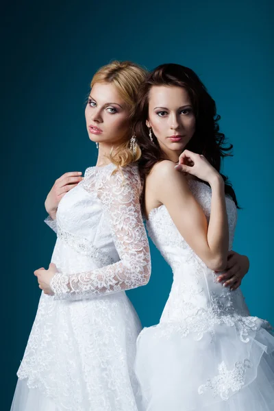 Two lovely blonde and brunette bride — Stock Photo, Image