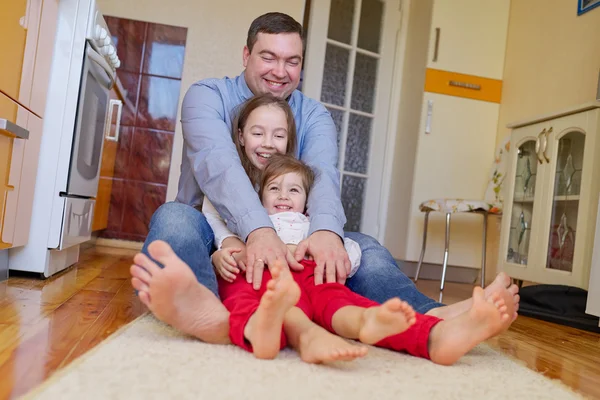 Happy family at home on the floor — Stock Photo, Image