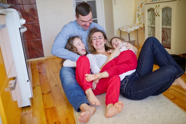 Happy family at home on the floor — Stock Photo, Image