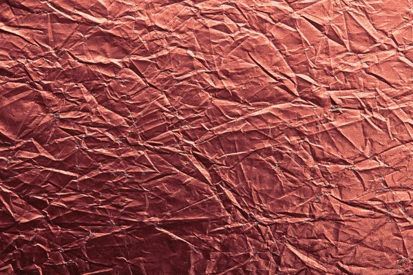 Red crumpled paper texture macro — Stock Photo, Image