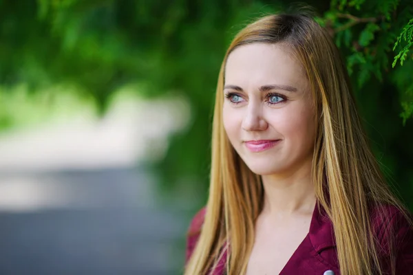 Blonde girl on green background — Stock Photo, Image