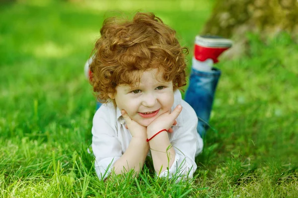 Modern boy on the grass — Stock Photo, Image