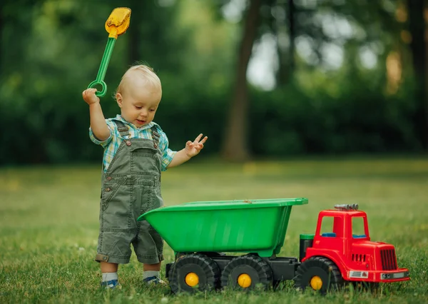 Little constructor with shovel — Stock Photo, Image